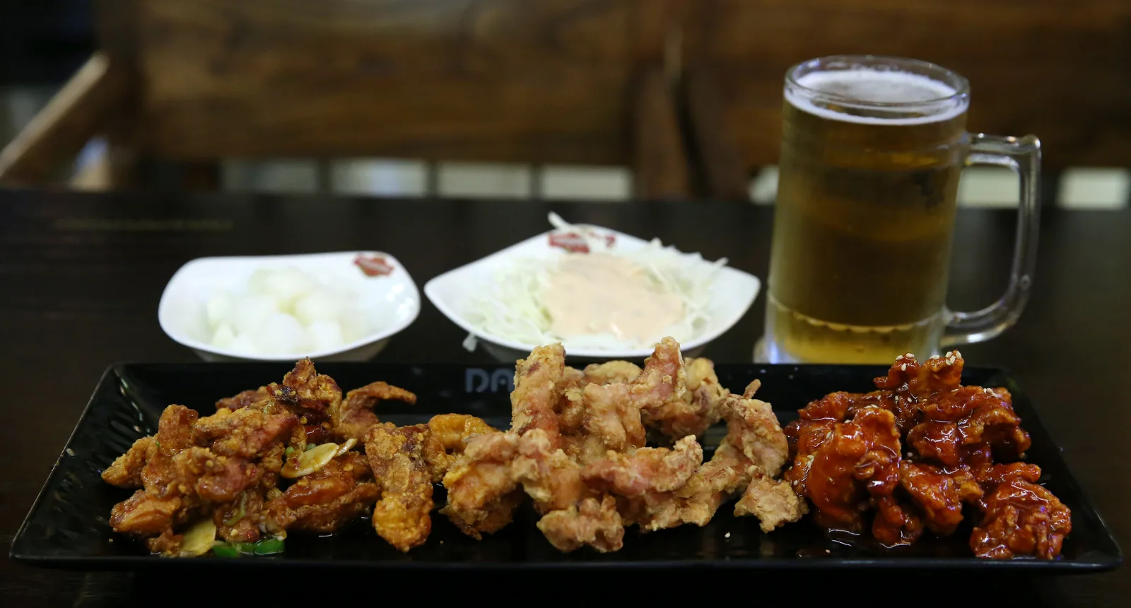 Korean fried chicken served with a mug of draft beer, known as chimaek. Source: Wikipedia