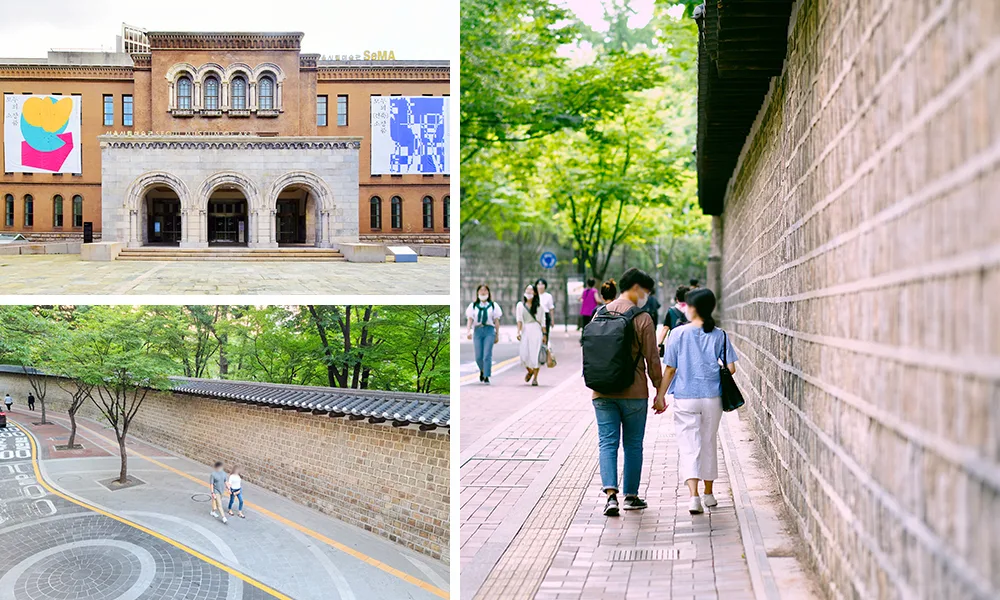 Visitors, including a couple holding hands, walking along the Deoksugung stone wall road. Photo: Visit Seoul