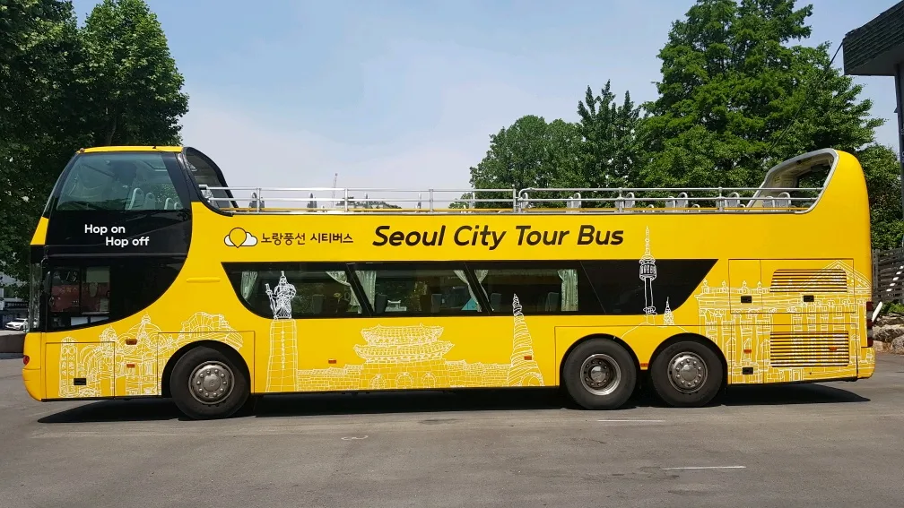 The yellow Seoul City Tour Bus, a hop-on, hop-off open-top double-decker. Photo: Visit Seoul