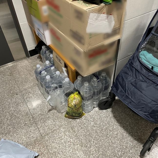 A yellow food waste bag left in an apartment hallway in Korea. Photo: Naver News