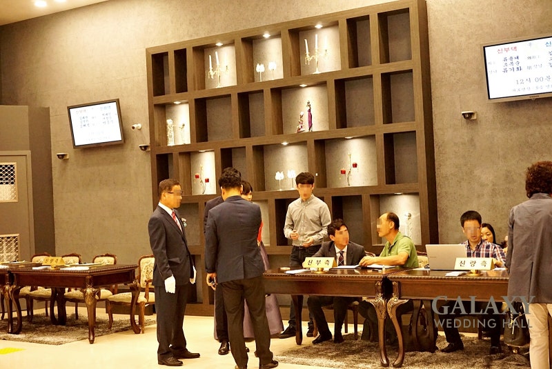 Cash gift reception desk at a wedding hall entrance